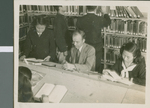 R. C. Cannon Reading in the Library with Students at Ibaraki Christian College, Ibaraki, Japan, ca.1948-1952