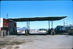 Vehicles at filling station by Haven L. Miller