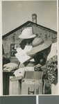 Brittell family opens boxes, Africa, ca. 1941-1959