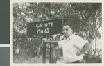 Don Carter Stands Next to a Sign for the Village of Ganti, Ganti, India, 1966
