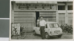 John Chang Stands in front of his Publishing House, Kuala Lumpur, Malaysia, 1967