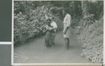 Boyd Reese Baptizes a Baptismal Candidate, Ikot Usen, Nigeria, 1950 by Eldred Echols and Boyd Reese