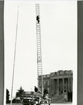 Fire truck with a man on a ladder